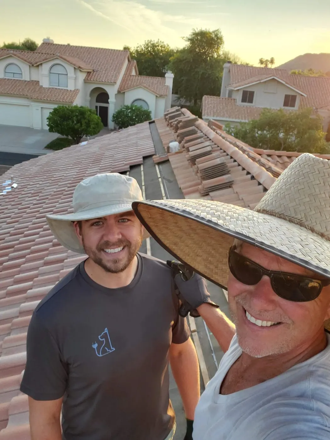 Dan Jr. and Dan Sr. on a tile roof