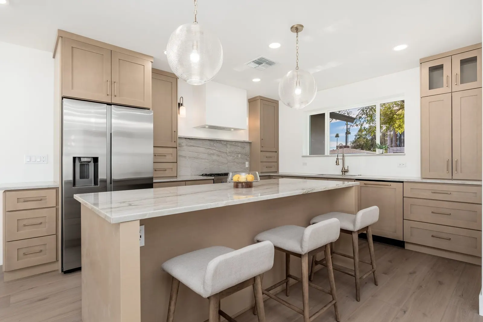 Kitchen with island seating and pendant lights